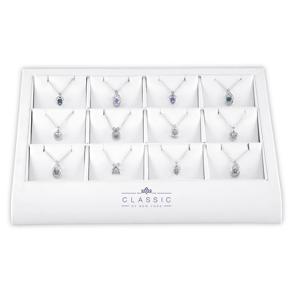 12 piece Dancing diamond and tanzanite Pendant on display