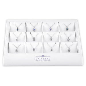 12 piece Dancing diamond and tanzanite Pendant on display